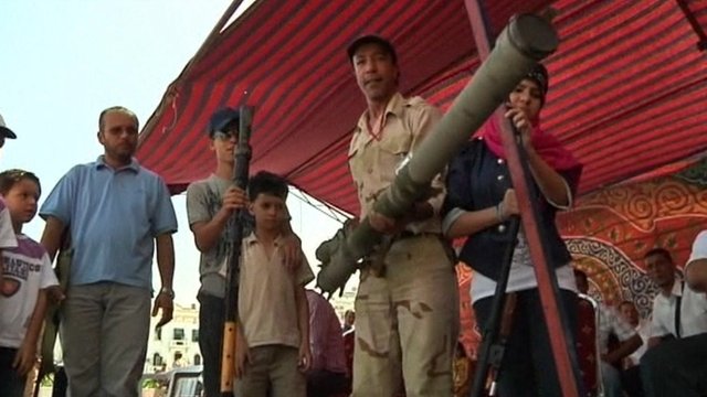 Libyans willingly disarm themselves