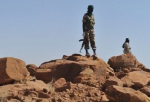 Nigerien soldiers patrol on the road between Agadez and Arlit on September 26, 2010 near Arlit. Gunmen seized the five French nationals, most working for France's state-owned nuclear giant Areva or its engineering sub-contractor Satom, amd a Togolese and a Madagascan in a raid on September 16 on a uranium mining town in the deserts of northern Niger. Army chiefs and counter-terrorism experts from the Sahel region were meeting Sunday in southern Algeria in a bid to come to grips with the growing threat of Al-Qaeda-linked militants. AFP PHOTO / ISSOUF SANOGO (Photo credit should read ISSOUF SANOGO/AFP/Getty Images)