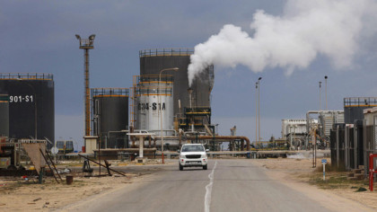 A general view shows an oil refinery in Zawia, 55km west of Tripoli December 18, 2013. Libya is stepping up fuel imports, with four tankers queuing at one port as the OPEC producer's second-largest refinery is running at only half its capacity due to oilfield strikes, a senior official said. A mix of militias, tribesmen and civil servants demanding political rights or a greater share of Libya's oil wealth have occupied several oilfields and ports, cutting exports to 110,000 barrels per day (bpd) from over 1 million bpd in July. The government has struggled to keep the 120,000-bpd refinery in Zawiya operating since protesters in October closed the El Sharara oilfield that feeds it. Since then, Zawiya has runs off existing stocks and supplies from the eastern Brega port, which officials have closed for exports for that reason. To match Interview LIBYA-OIL/REFINERY Picture taken December 18, 2013. REUTERS/Ismail Zitouny (LIBYA) - RTX16OQI