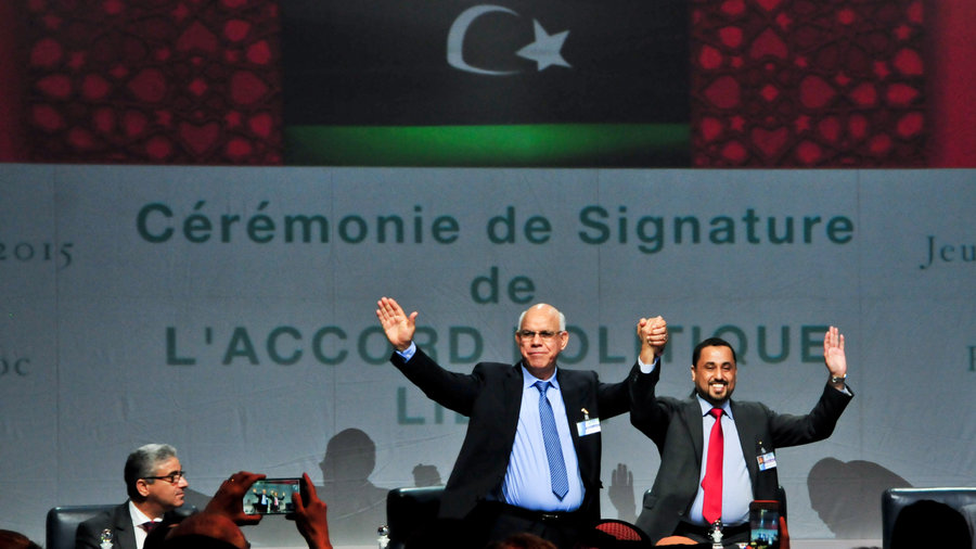 Libya deputies sign political agreement in disagreement