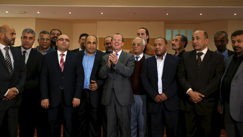 UN Special Representative and Head of the UN Support Mission in Libya Kobler poses with representatives of Libyan municipalities after their meeting in Tunis