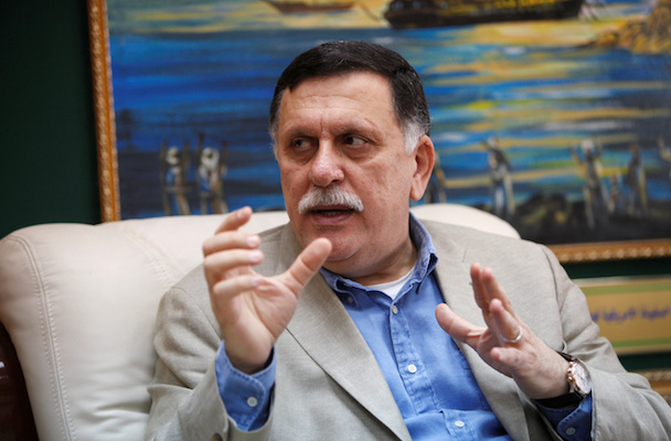 Prime Minister of Libya’s unity government Fayez Seraj speaks during an interview with Reuters at his office in the naval base of Tripoli