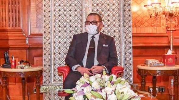 King Mohammed VI wearing a facemask