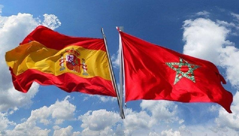Morocco-Spain flags- cloudy sky