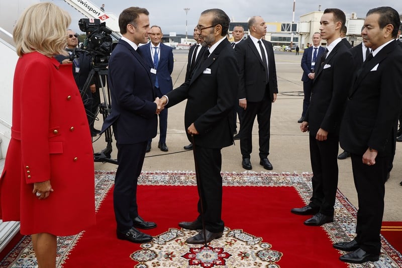 King Mohammed VI welcomes French President Emmanuel Macron upon arrival in Rabat on a state visit aimed at reshaping a strategic partnership