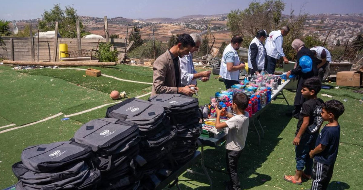 Bayt Mal Al-Quds Asharif Agency donates Palestinian kids school backpacks rekindling joy